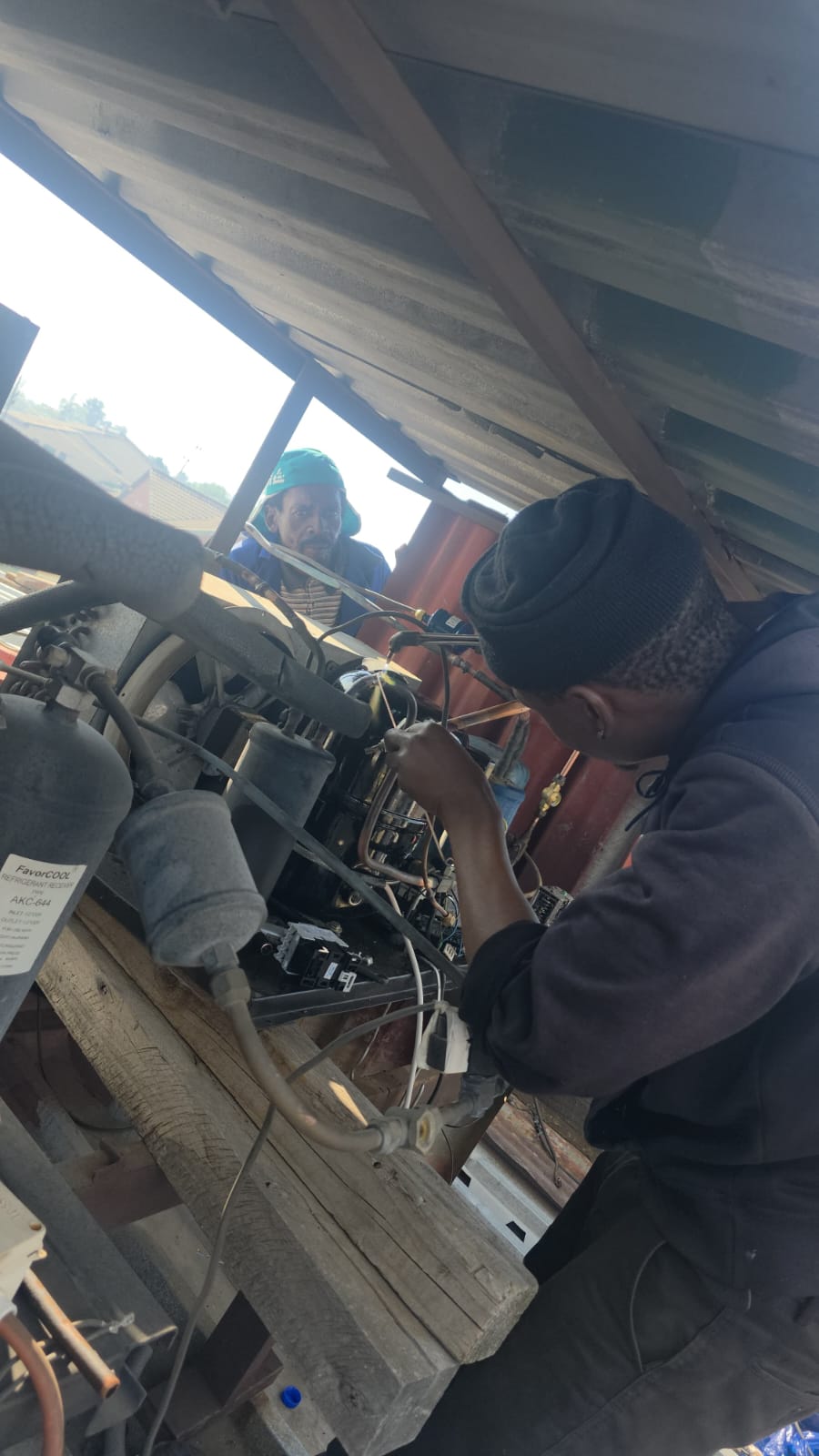 NOVA Cool technicians working on refrigeration compressor pipework on site